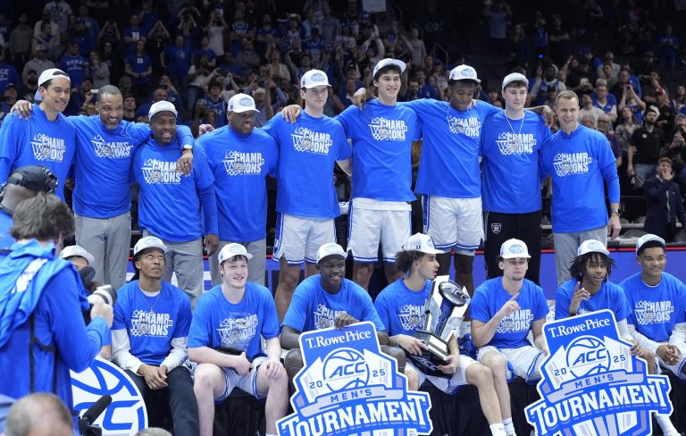 The Duke Blue Devils celebrate after winning the 2025 ACC Conference Championship game against the Louisville Cardinals at Spectrum Center.
