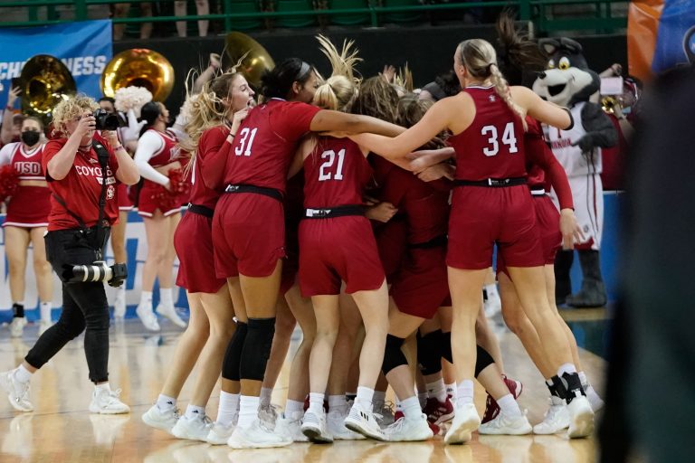 The South Dakota Coyotes celebrate the win over against the Baylor Lady Bears at Ferrell Center.
