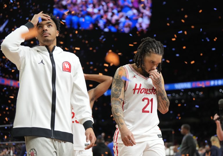 Houston Cougars guard Emanuel Sharp (21) and teammates walk off the court after losing to the Florida Gators in the national championship game of the Final Four of the 2025 NCAA Tournament at the Alamodome