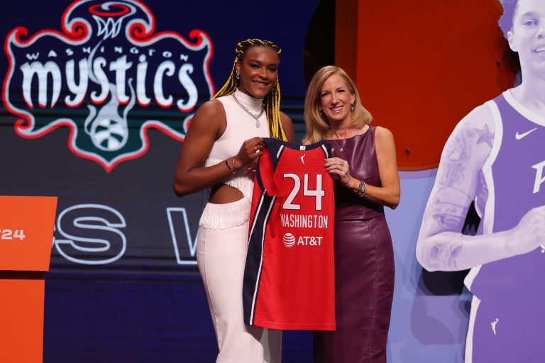 Aaliyah Edwards poses with WNBA commissioner Cathy Engelbert after she is selected with the number six overall pick to the Washington Mystics in the 2024 WNBA Draft at Brooklyn Academy of Music.