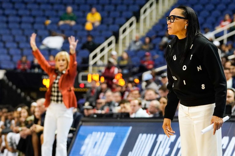 Baylor Lady Bears head coach Kim Mulkey and South Carolina Gamecocks head coach Dawn Staley both yell to their teams during the second half in the semifinals of the Greensboro regional in the women's 2019 NCAA Tournament at Greensboro Coliseum.