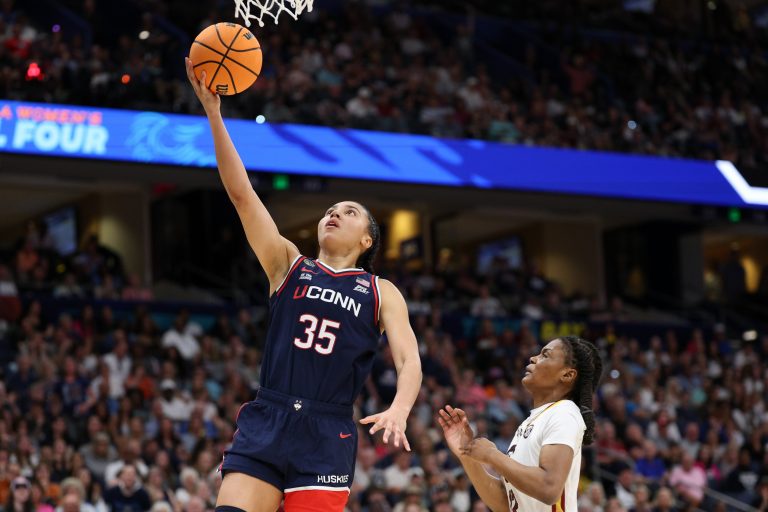 Connecticut Huskies guard Azzi Fudd (35) shoots the ball South Carolina Gamecocks guard MiLaysia Fulwiley (12) during the first half of the national championship of the women's 2025 NCAA tournament at Amalie Arena.