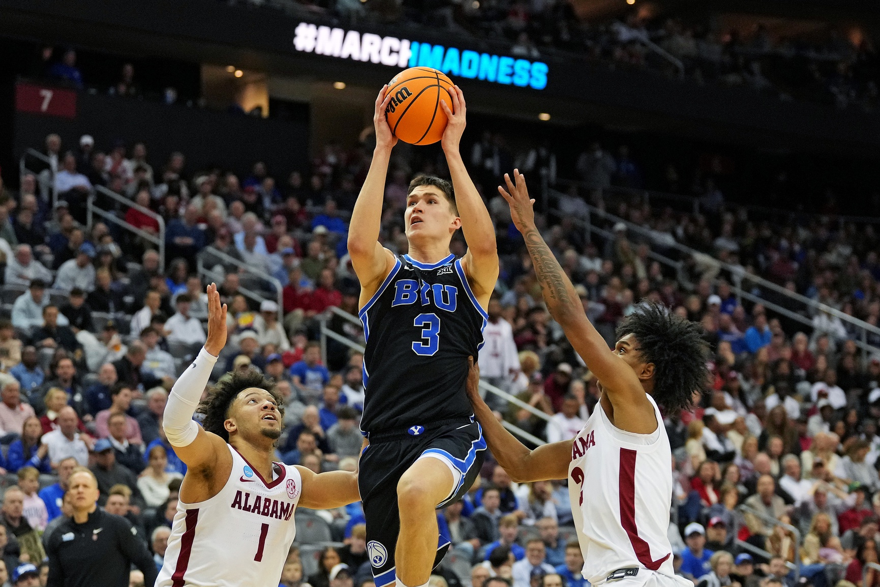 Brigham Young Cougars guard Egor Demin (3) drives to the basket against Alabama Crimson Tide guard Mark Sears (1) during the second half during an East Regional semifinal of the 2025 NCAA tournament at Prudential Center.