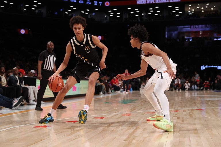 McDonald's All American East forward Nate Ament (10) dribbles the ball against McDonald's All American West guard Mikel Brown Jr. (11) during the second half of the game at Barclays Center.