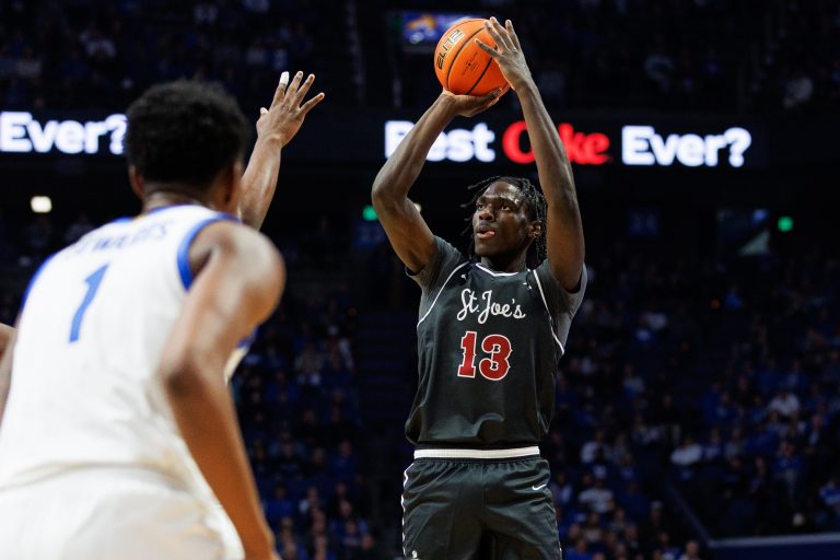 Saint Joseph's Hawks forward Rasheer Fleming (13) shoots the ball during the first half against the Kentucky Wildcats at Rupp Arena at Central Bank Center.