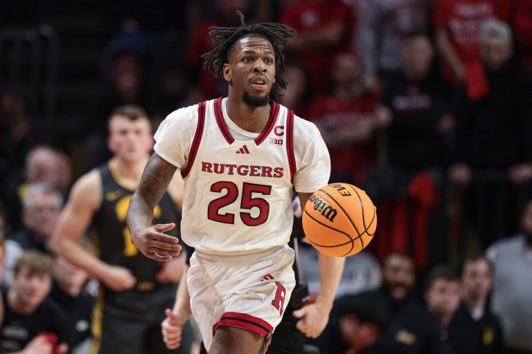 Rutgers Scarlet Knights guard Jeremiah Williams (25) dribbles up court during the second half against the Iowa Hawkeyes at Jersey Mike's Arena.