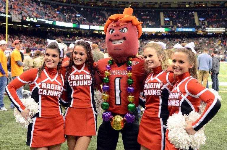 Dec. 17, 2011; New Orleans, LA, USA; Louisiana-Lafayette Ragin Cajuns mascot Cayenne with four cheerleaders during the New Orleans Bowl against the San Diego State Aztecs at the Mercedes-Benz Superdome. Louisiana-Lafayette defeated the San Diego State Aztecs, 32-30.