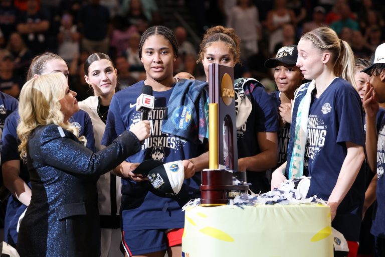 ESPN reporter Holly Rowe interviews Connecticut Huskies forward Sarah Strong (21) after the national championship of the women's 2025 NCAA tournament against the South Carolina Gamecocks at Amalie Arena.