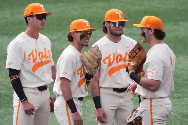From left, Tennessee infielders Dean Curley (1), Manny Marin (4), Gavin Kilen (6), and Andrew Fisher (11) gather to chat during a pause in the NCAA college baseball game against St. Bonaventure on Sunday, March 9, 2025, in Knoxville, Tenn.