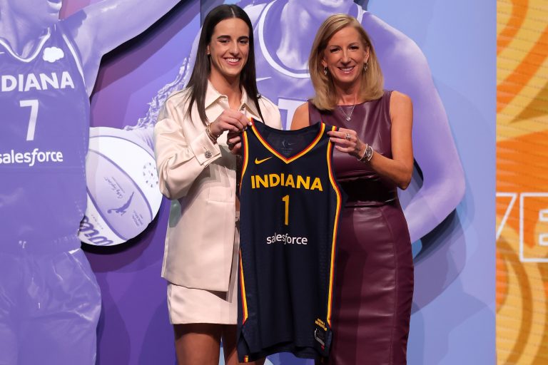 Caitlin Clark poses with WNBA commissioner Cathy Engelbert after being selected with the number one overall pick to the Indiana Fever during the 2024 WNBA Draft at the Brooklyn Academy of Music.