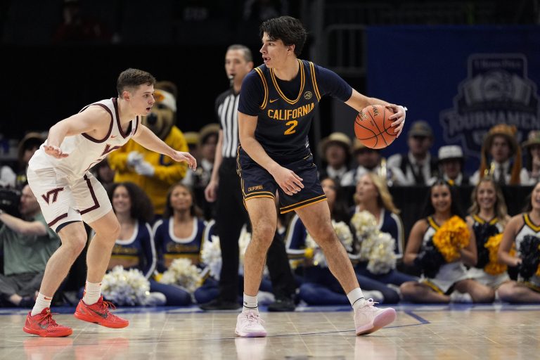 California Golden Bears guard Andrej Stojakovic (2) handles the ball defended by Virginia Tech Hokies guard Brandon Rechsteiner (7) during OT at Spectrum Center.