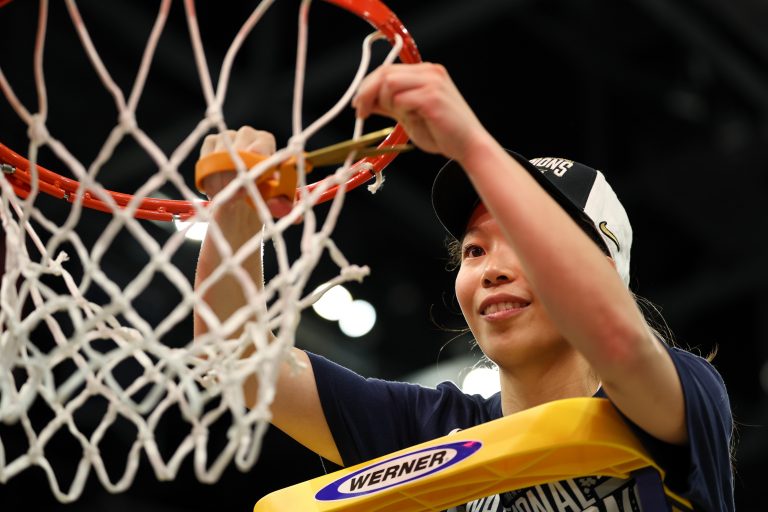 Connecticut Huskies guard Kaitlyn Chen (20) cuts down the net after the national championship of the women's 2025 NCAA tournament against the South Carolina Gamecocks at Amalie Arena.
