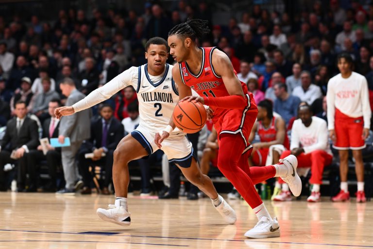 Saint John's Red Storm guard Jaiden Glover (11) drives against Villanova Wildcats guard Jhamir Brickus (2) in the first half at William B. Finneran Pavilion.
