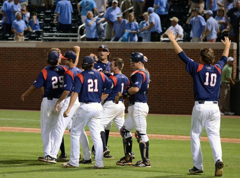 Florida Atlantic Owls pitcher Hugh Adams (top center) celebrates with teammates after defeating the North Carolina Tarheels during the Chapel Hill Regional of the NCAA Baseball Tournament at Boshamer Stadium.