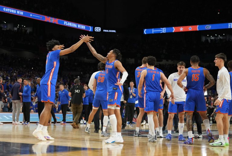 Florida Gators players celebrate after defeating the Auburn Tigers in the semifinals of the men's Final Four of the 2025 NCAA Tournament at the Alamodome.