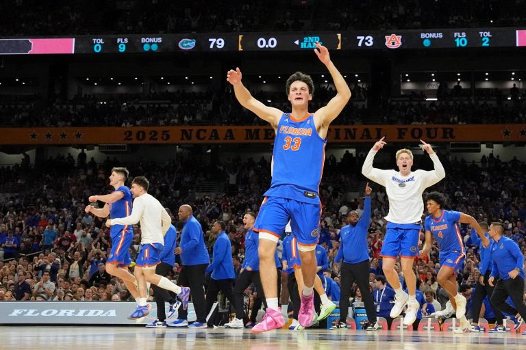 Florida Gators guard Cooper Josefsberg (33) celebrates after their win against the Auburn Tigers in a semifinal of the men's Final Four of the 2025 NCAA Tournament at the Alamodome.