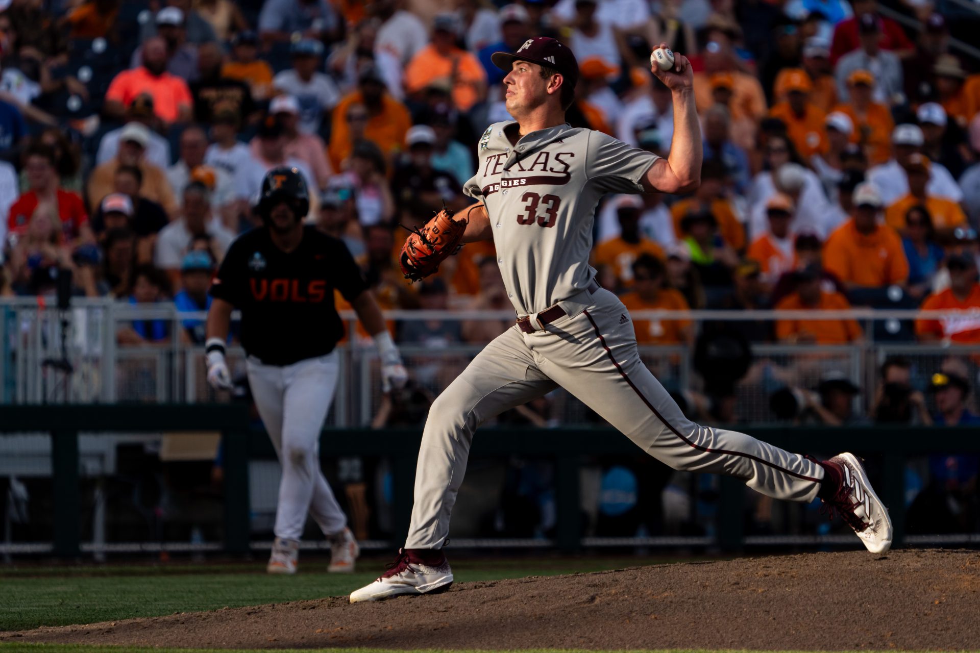 Texas A&M Aggies starting pitcher Justin Lamkin (33) pitches against the Tennessee Volunteers during the third inning at Charles Schwab Field Omaha.