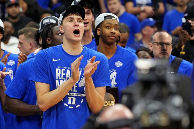 Duke Blue Devils forward Cooper Flagg (2) cheers as the Duke Blue Devils cuts down the nets after beating the Alabama Crimson Tide in the East Regional final of the 2025 NCAA tournament at Prudential Center.