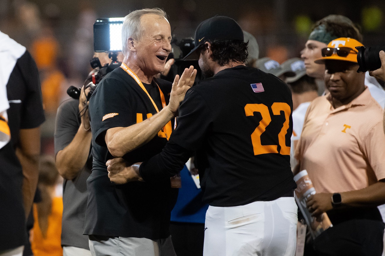 Tennessee basketball head coach Rick Barnes congratulates Tennessee baseball head coach Tony Vitello after game three of the NCAA College World Series finals between Tennessee and Texas A&M at Charles Schwab Field in Omaha, Neb., on Monday, June 24, 2024.