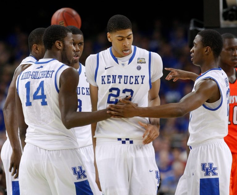 UK's Anthony Davis, #23, center, is congratulated by teammates Michael Kidd-Gilchrist, #14, left, and Doron Lamb, #20, right, after a play during the Final Four in New Orleans.Mar. 31, 2012