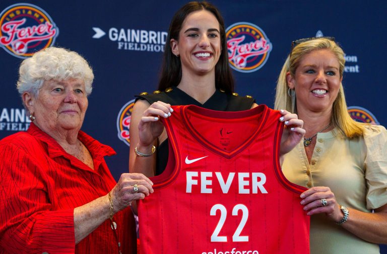 Indiana Fever's Caitlin Clark, former Iowa Hawkeye standout and the no. 1 pick in the 2024 WNBA draft, poses Wednesday, April 17, 2024, after an introductory press conference inside the entry pavilion at Gainbridge Fieldhouse. Beside Clark are Fever general manager Lin Dunn and coach Christie Sides. Mandatory credit: Mykal McEldowney-USA TODAY NETWORK via Imagn Images