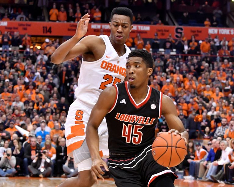 Louisville Cardinals guard Donovan Mitchell (45) drives the ball past Syracuse Orange guard Tyus Battle (25) during the first half of a game at the Carrier Dome.