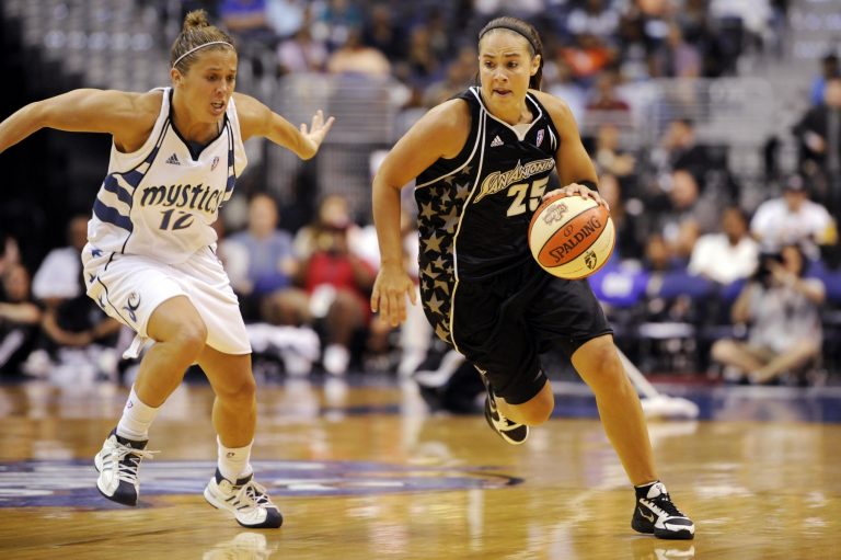 San Antonio Silver Stars guard Becky Hammon (25) drives up court while being trailed by Washington Mystics guard Ashley Houts during the first half at the Verizon Center.