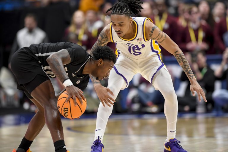 LSU Tigers forward Tyrell Ward (15) guards Mississippi State Bulldogs guard Dashawn Davis (10) during the second half at Bridgestone Arena.