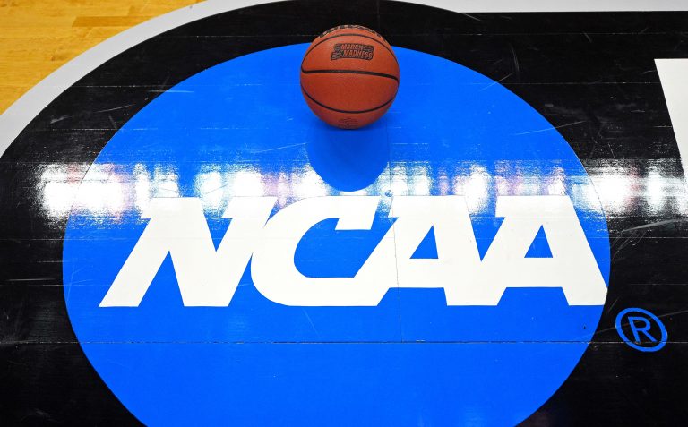 A view of the NCAA logo and basketball before the game between the Virginia Cavaliers and the UMBC Retrievers in the first round of the 2018 NCAA Tournament at Spectrum Center.