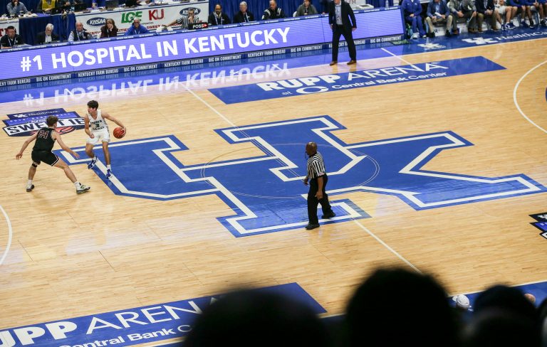 Kentucky-commit Reed Sheppard brings the ball up the court atop the large UK logo at the UK HealthCare Boys Sweet 16 tournament Wednesday at Rupp Arena. March 15, 2022