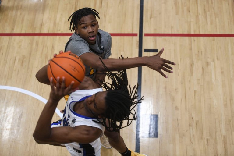 Team Thad Jamarion Fleming (23) jumps to block Team Durant Malcolm Thomas (20) as he shoots the ball during the Team Thad and Team Durant game at the fifth day of the Nike Peach Jam at Riverview Park Activities Center. Team Thad defeated Team Durant 76-65.