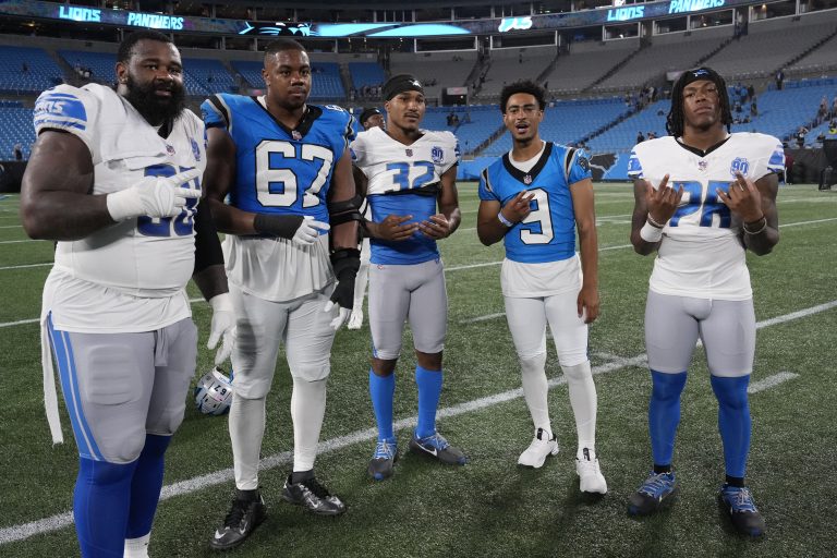 Former Alabama players Detroit Lions defensive end Isaiah Buggs (96) and Carolina Panthers defensive tackle LaBryan Ray (67) and safety Brian Branch (32) and quarterback Bryce Young (9) and running back Jermar Jefferson (28) after the game at Bank of America Stadium.