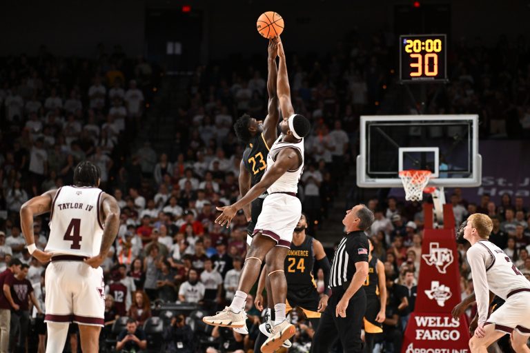exas A&M Aggies forward Wildens Leveque (10) and Texas A&M Commerce forward KC Ugwuakazi (23) tip off to start the game at Reed Arena.