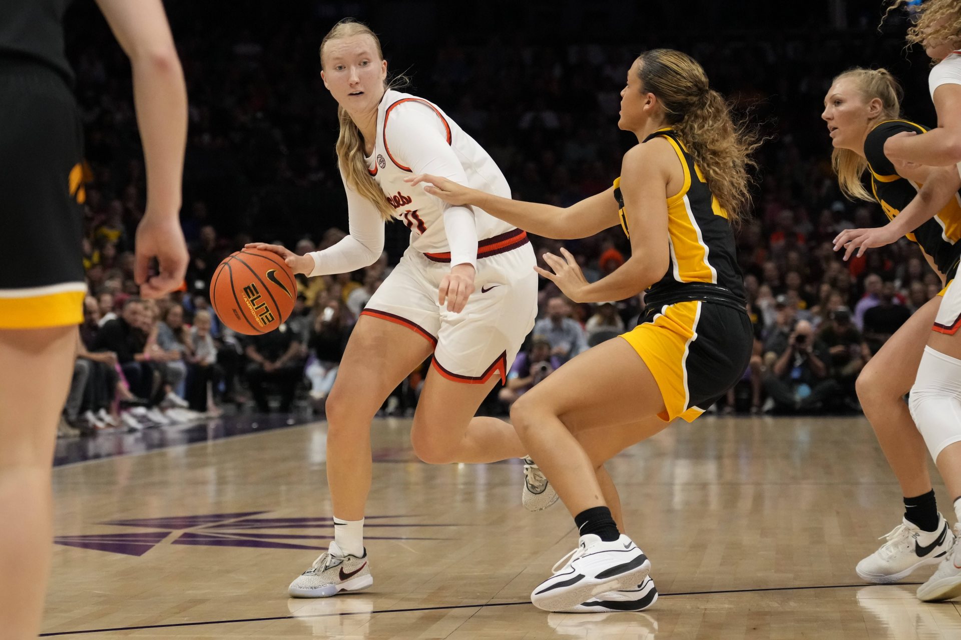 Virginia Tech Hokies guard Matilda Ekh (11) drives to the basket against Iowa Hawkeyes guard Gabbie Marshall (24) the Iowa Hawkeyes during the first half at Spectrum Center.