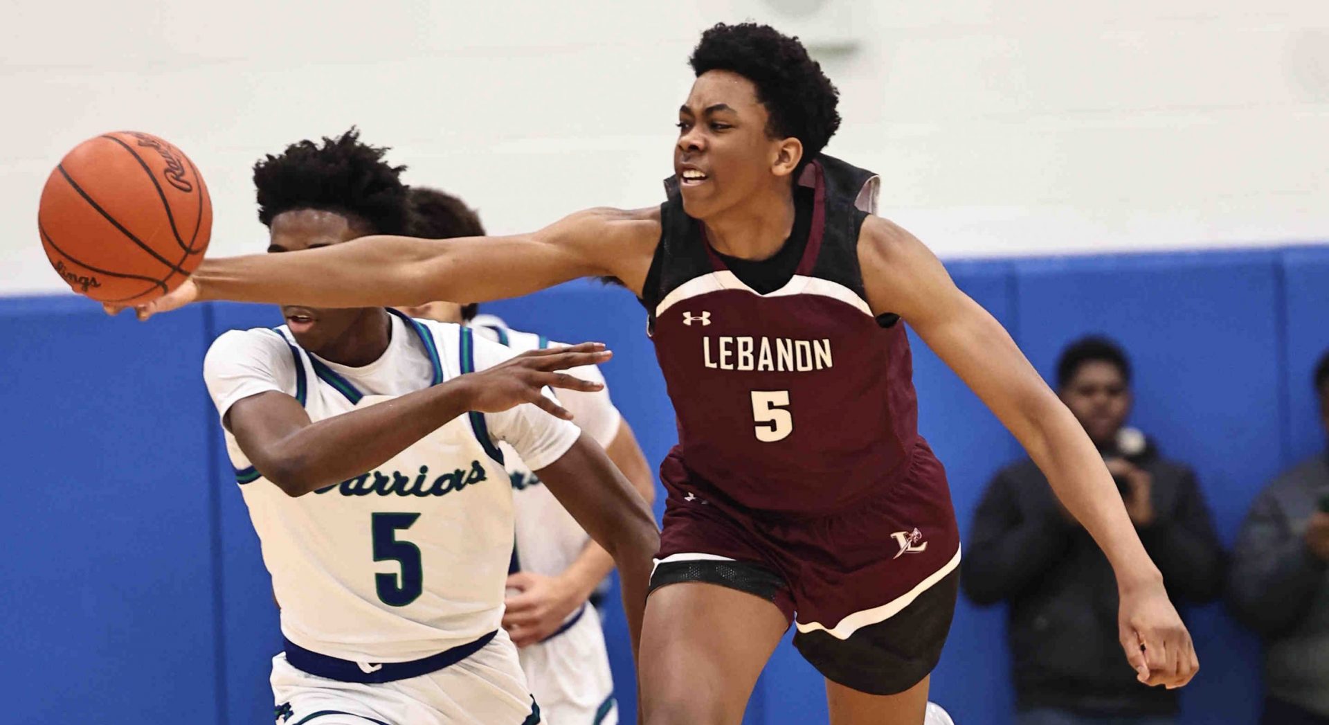 Lebanon forward Anthony Thompson (5) battles Winton Woods guard Nate Dawson (5) for a loose ball during their 50-61 loss Friday, Jan. 5, 2024.