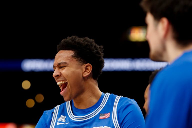 Memphis' Ashton Hardaway (4) reacts after Nae'Qwan Tomlin (7) dunked the ball during the game between University of Alabama