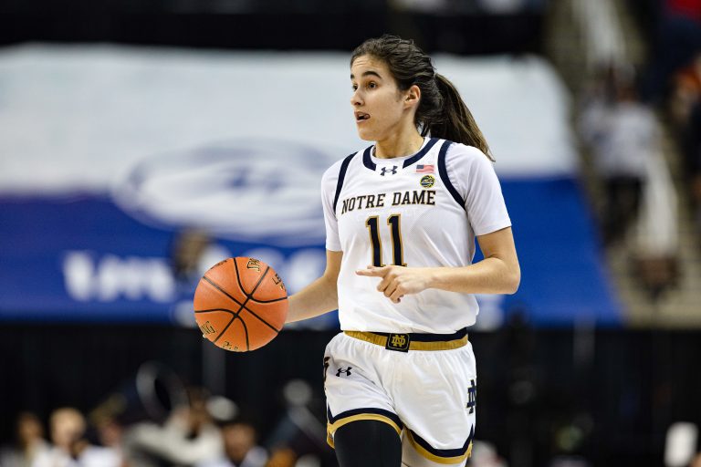Notre Dame Fighting Irish guard Sonia Citron (11) dribbles the ball in the first half against the Louisville Cardinals at Greensboro Coliseum.