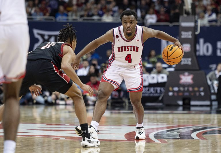 Houston Cougars guard LJ Cryer (4) controls the ball while defended by Texas Tech Red Raiders guard Chance McMillian