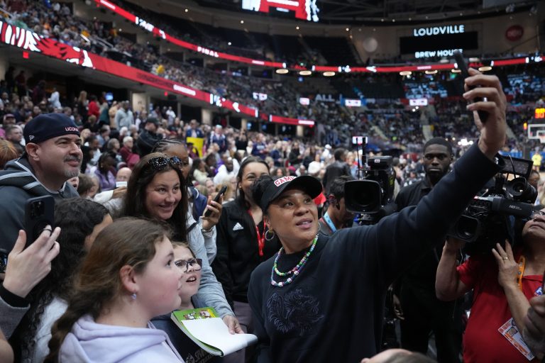 South Carolina Gamecocks head coach Dawn Staley poses for a selfie with fans at Rocket Mortgage FieldHouse.