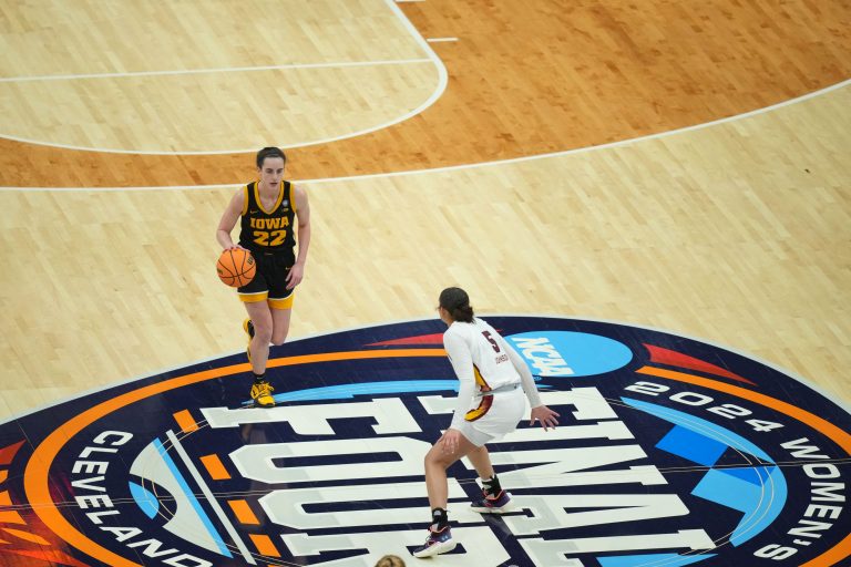 Iowa Hawkeyes guard Caitlin Clark (22) dribbles the ball against the South Carolina Gamecocks in the finals of the Final Four of the womens 2024 NCAA Tournament at Rocket Mortgage FieldHouse.