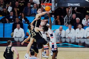 Purdue Boilermakers center Zach Edey (15) blocks Connecticut Huskies guard Tristen Newton (2) in the first half in the national championship game of the Final Four of the 2024 NCAA Tournament at State Farm Stadium in Glendale on April 8, 2024.