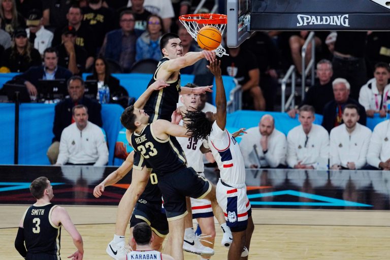 Purdue Boilermakers center Zach Edey (15) blocks Connecticut Huskies guard Tristen Newton (2) in the first half in the national championship game of the Final Four of the 2024 NCAA Tournament at State Farm Stadium in Glendale on April 8, 2024.