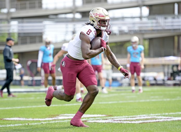 Florida State Seminoles wide receiver Hykeem Williams (8) runs the ball during the Spring Showcase at Doak S. Campbell Stadium.