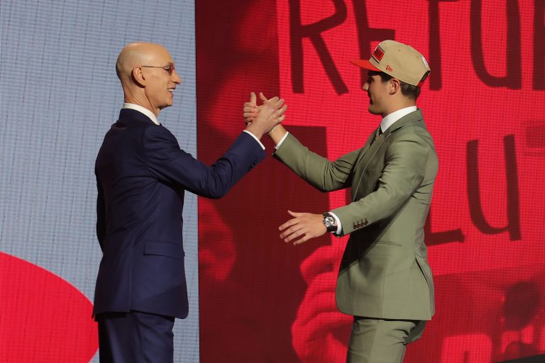 Reed Sheppard shakes hands with NBA commissioner Adam Silver after being selected in the first round by the Houston Rockets in the 2024 NBA Draft at Barclays Center.