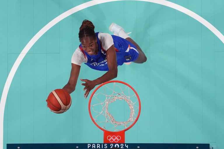 France center Dominique Malonga (14) goes to the basket against Canada during the Paris 2024 Olympic Summer Games at Stade Pierre-Mauroy.