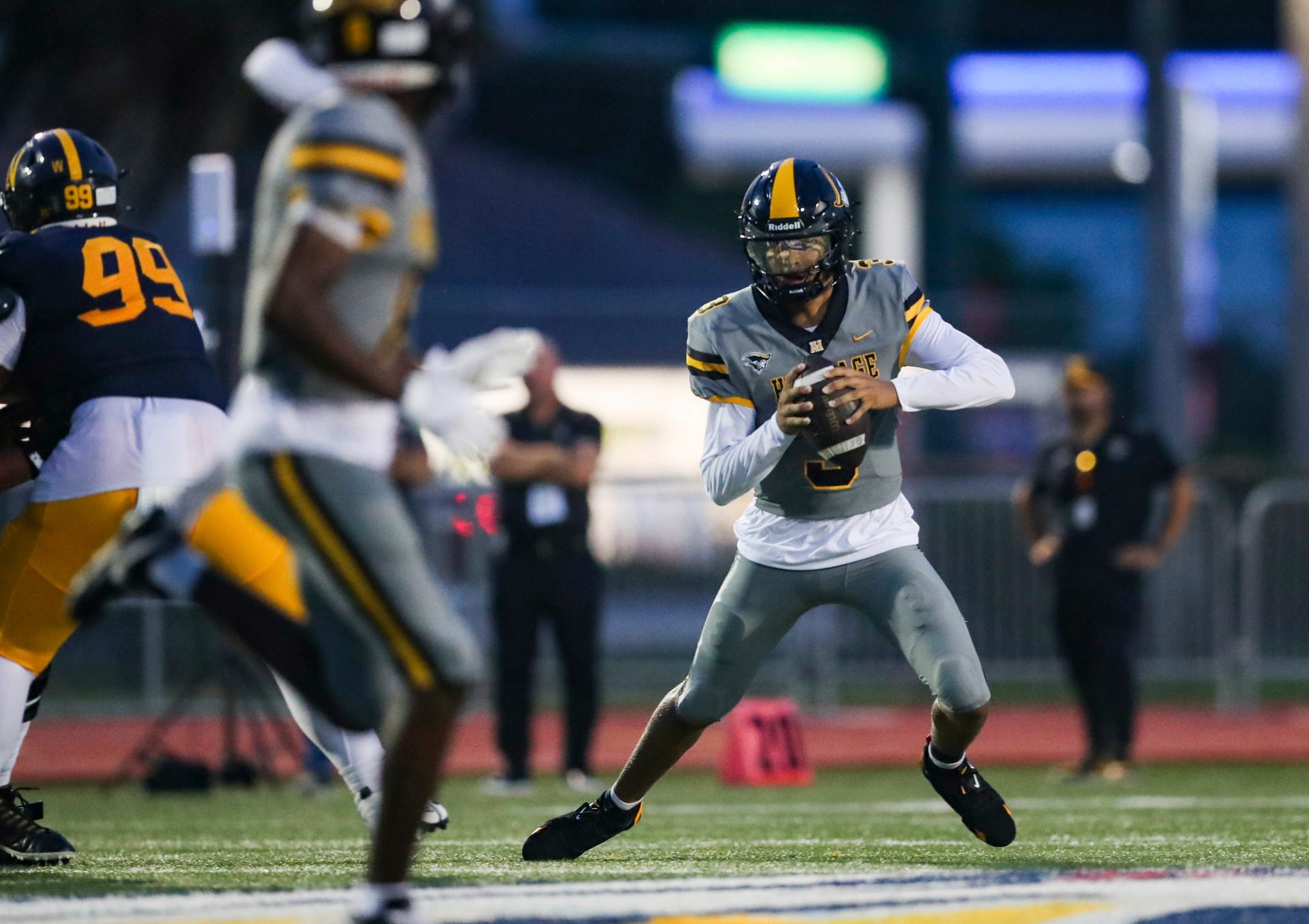 American Heritage Patriots quarterback Dia Bell (3) scrambles in the backfield during the first quarter of a game against the Naples Golden Eagles at Staver Field in Naples on Friday, Sept. 13, 2024.
