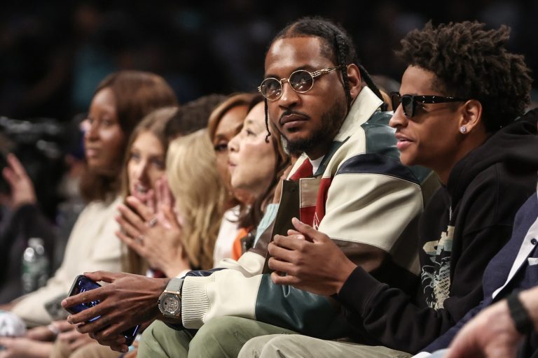 Former NBA forward Carmelo Anthony and his son Kyian Anthony during game two of the 2024 WNBA Semi-finals at Barclays Center.