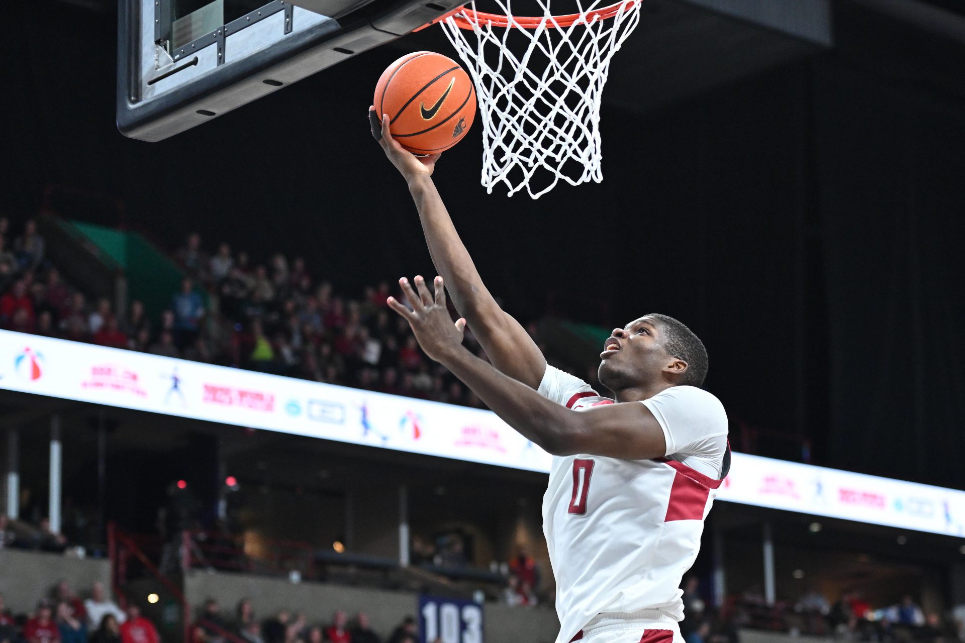 Washington State Cougars guard Cedric Coward (0) makes an easy lay up against the Eastern Washington Eagles in the first half at Spokane Veterans Memorial Arena.