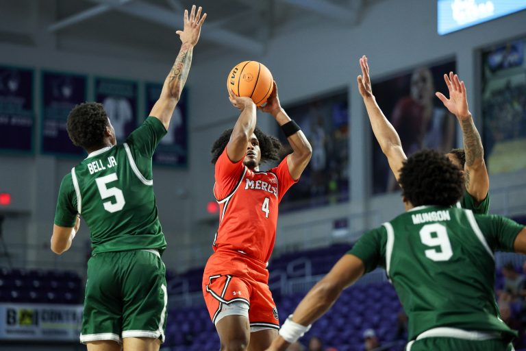 Mercer Bears guard Ahmad Robinson (4) shoots the ball over Jacksonville Dolphins guard Zach Bell (5) in the first half at Suncoast Credit Union Arena.
