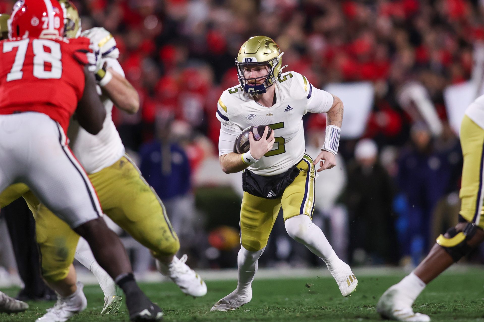 Georgia Tech Yellow Jackets quarterback Zach Pyron (5) runs the ball against the Georgia Bulldogs in the first quarter at Sanford Stadium.